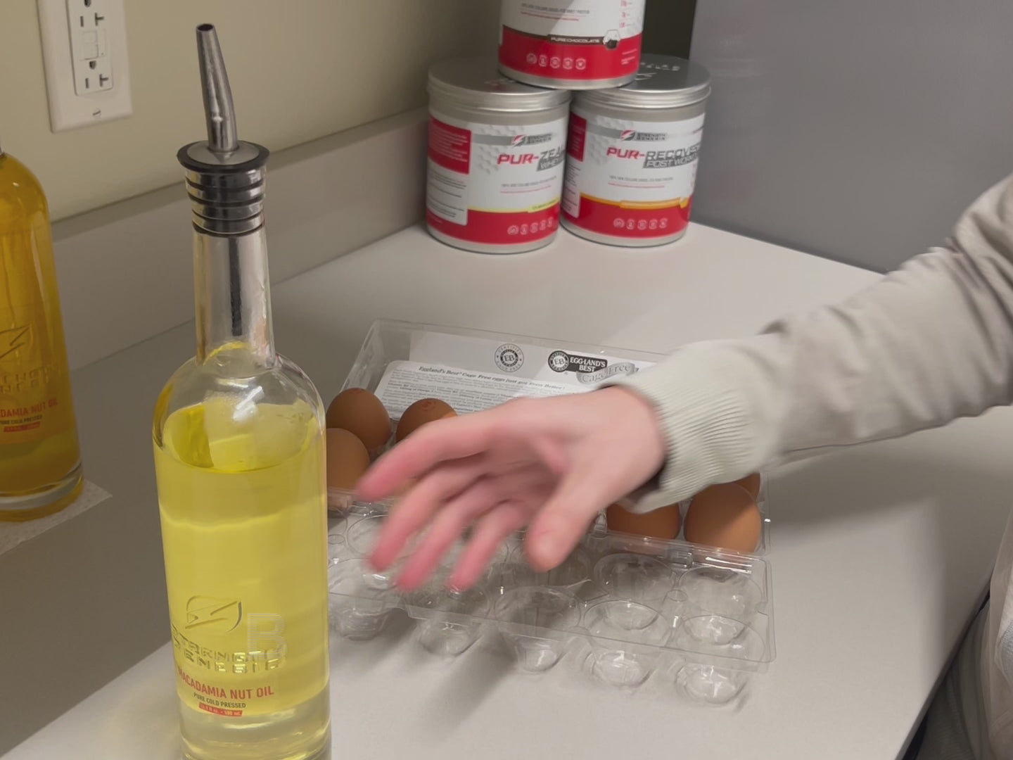 Macadamia nut oil being used to sauté vegetables, emphasizing its 515°F smoke point suitable for high-heat cooking