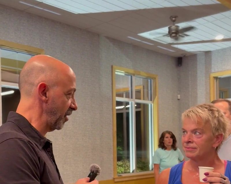 Dr. Derek talking with a client during the taste test