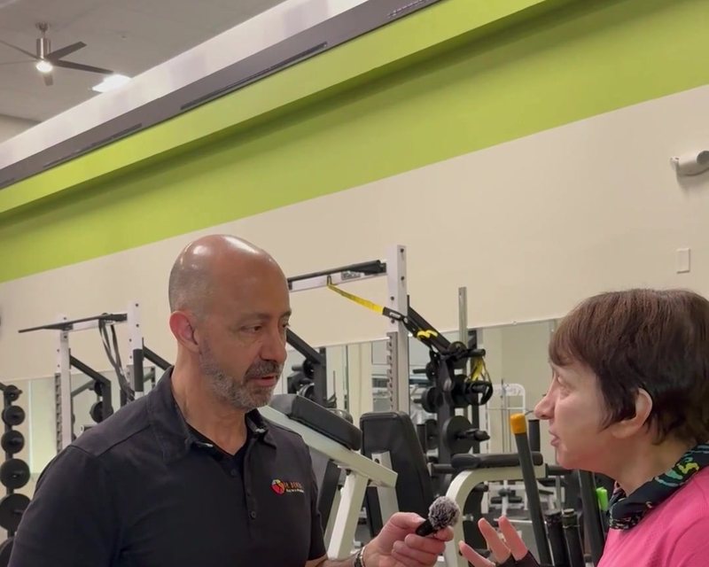 Dr. Derek handing out Hydrate samples at his clinic