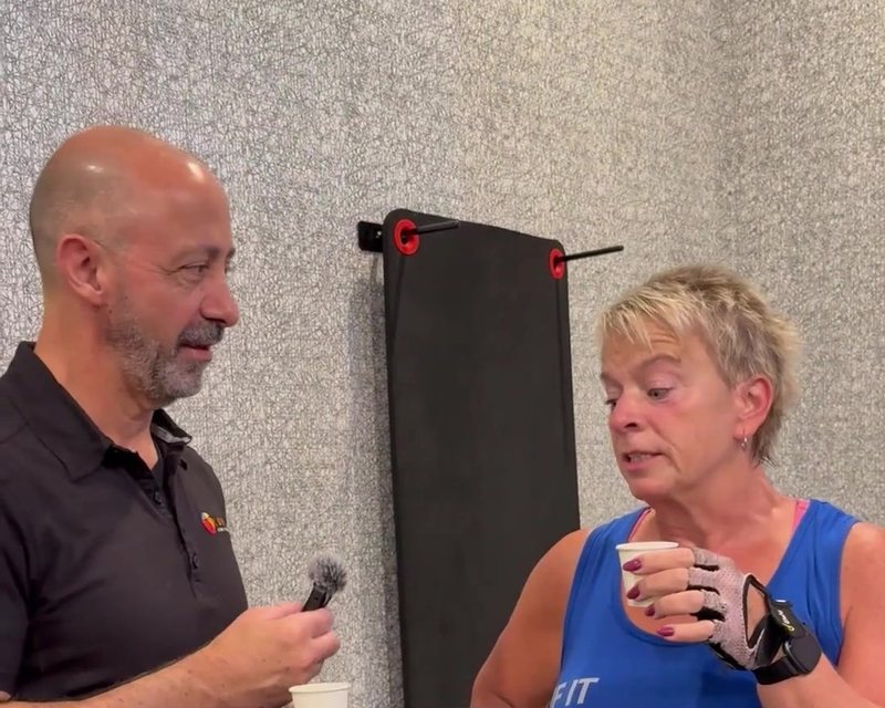 Dr. Derek talking with a client at his clinic